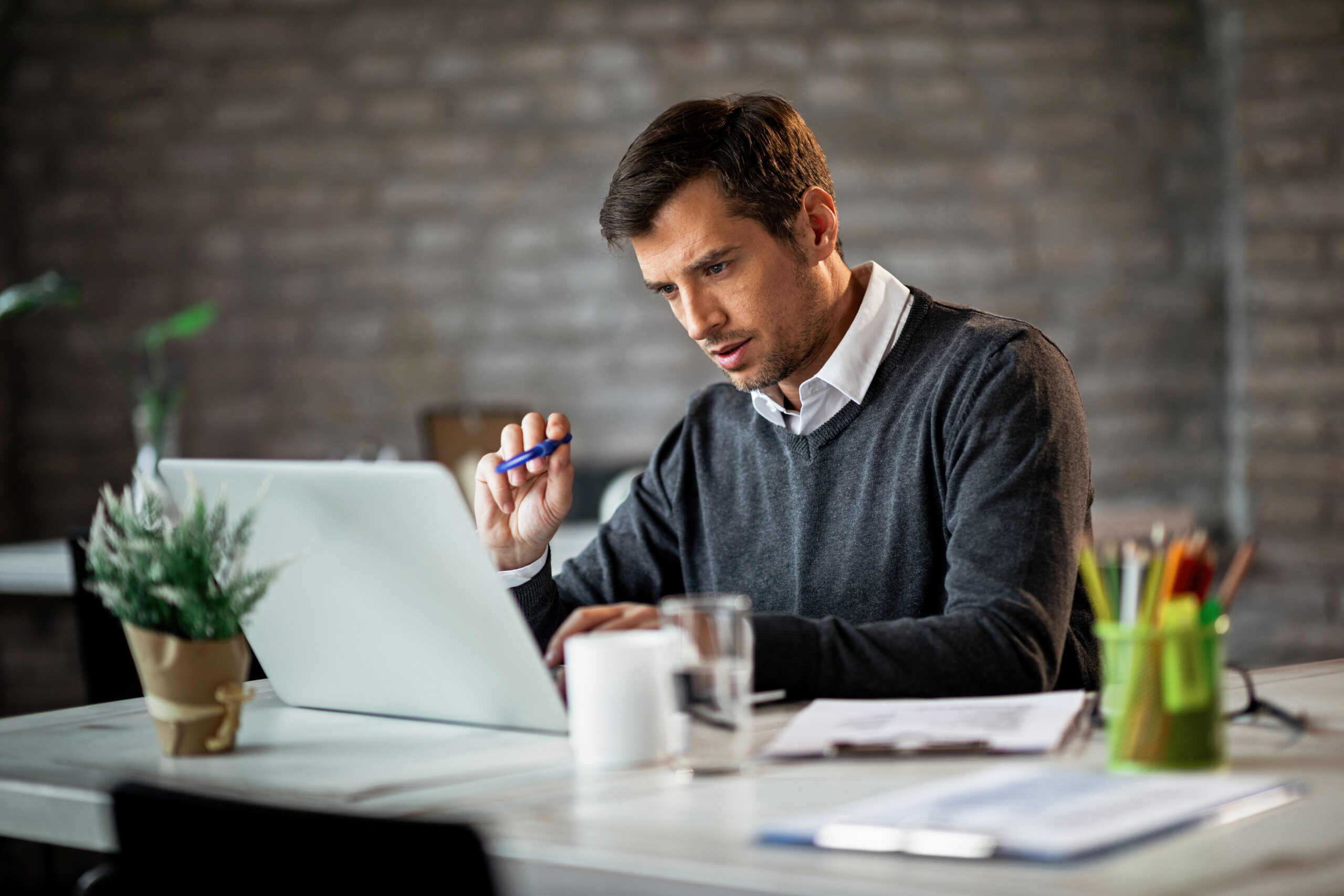 Businessman preparing a Canada C10 work permit application and business plan