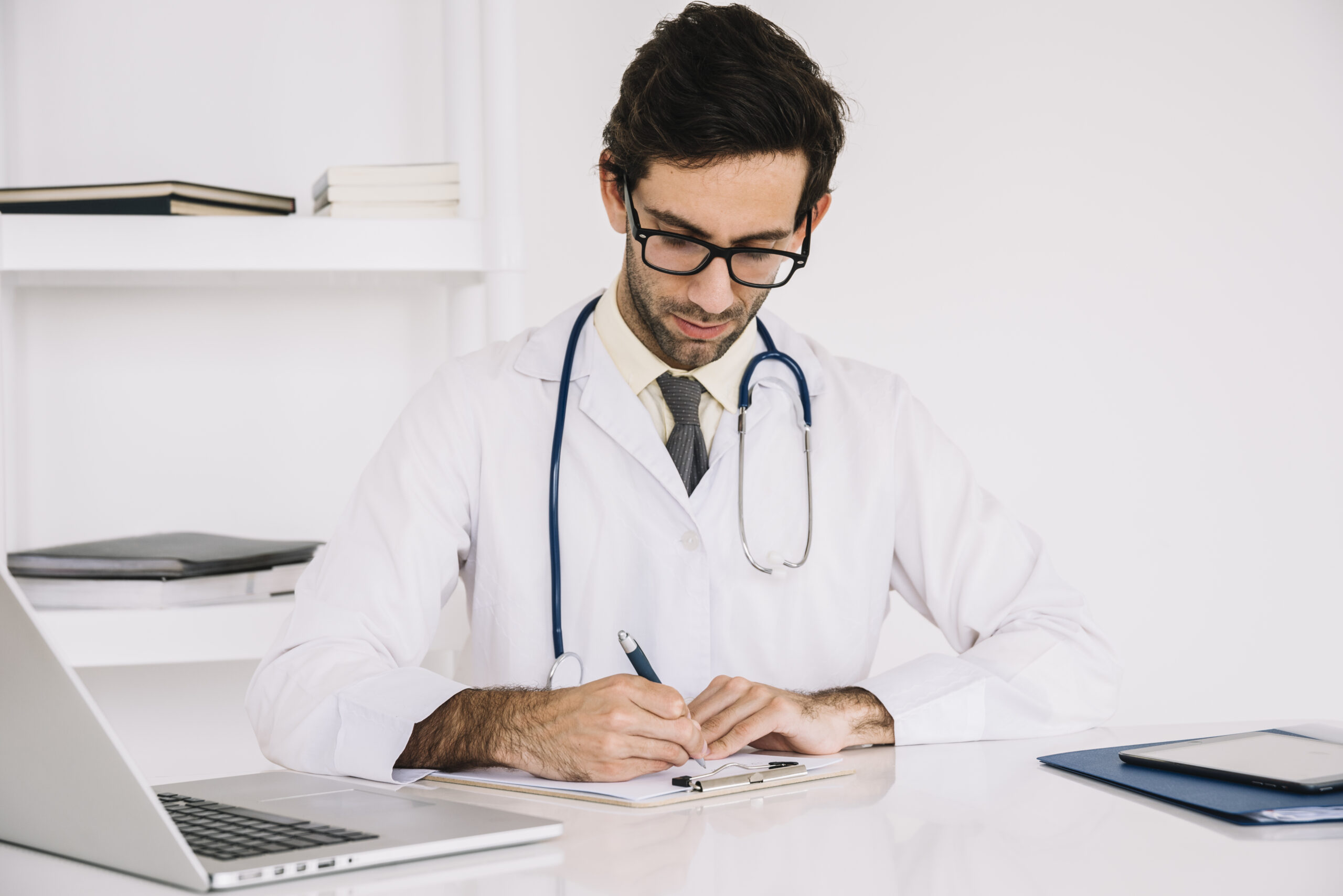 Doctor preparing a hospital letter and treatment plan for a Canada medical visa