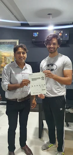 A Westside student with his result at the Lahore office