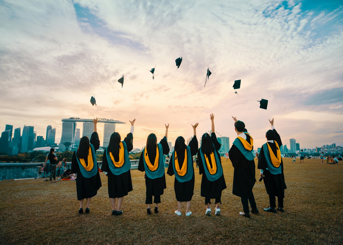 Graduates throwing their caps in the air