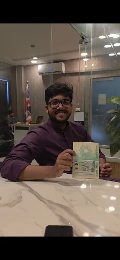 A Westside student holding his approved UK visa at the Lahore office