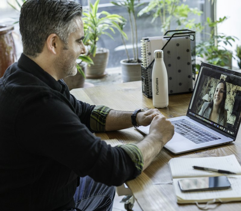 A man on a video call at his laptop