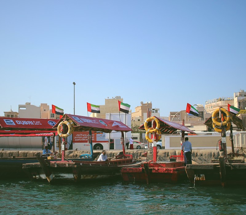 Colourful boats and souq buildings on Dubai Creek