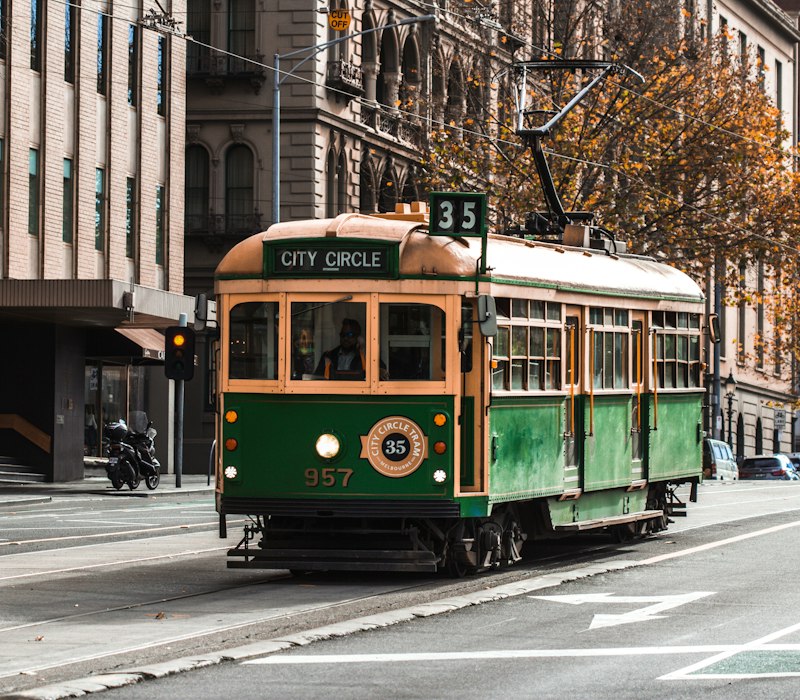 A classic green tram on a Melbourne street