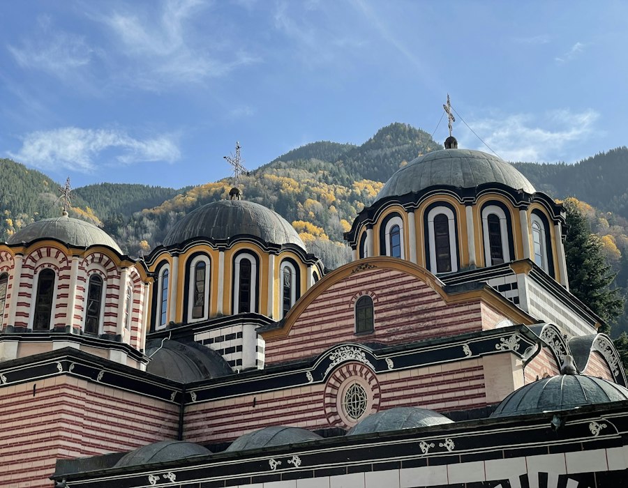 Rila Monastery below green mountains