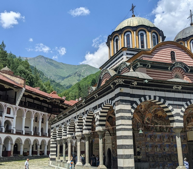 The striped arches and courtyard of Rila Monastery