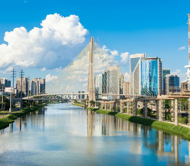 The Sao Paulo skyline and cable bridge by the river