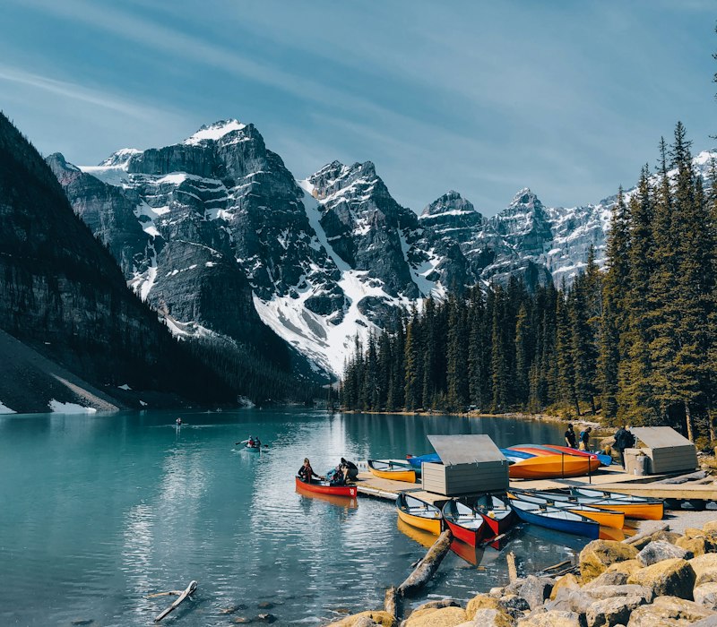 Canoes on the turquoise water of Moraine Lake near Banff