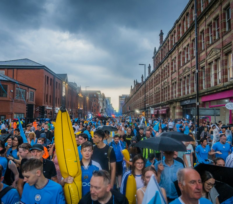 A lively crowd on a Manchester street