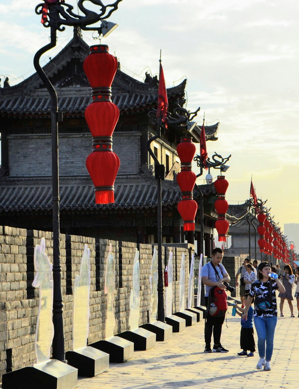 A lively old town street hung with red lanterns in Xian