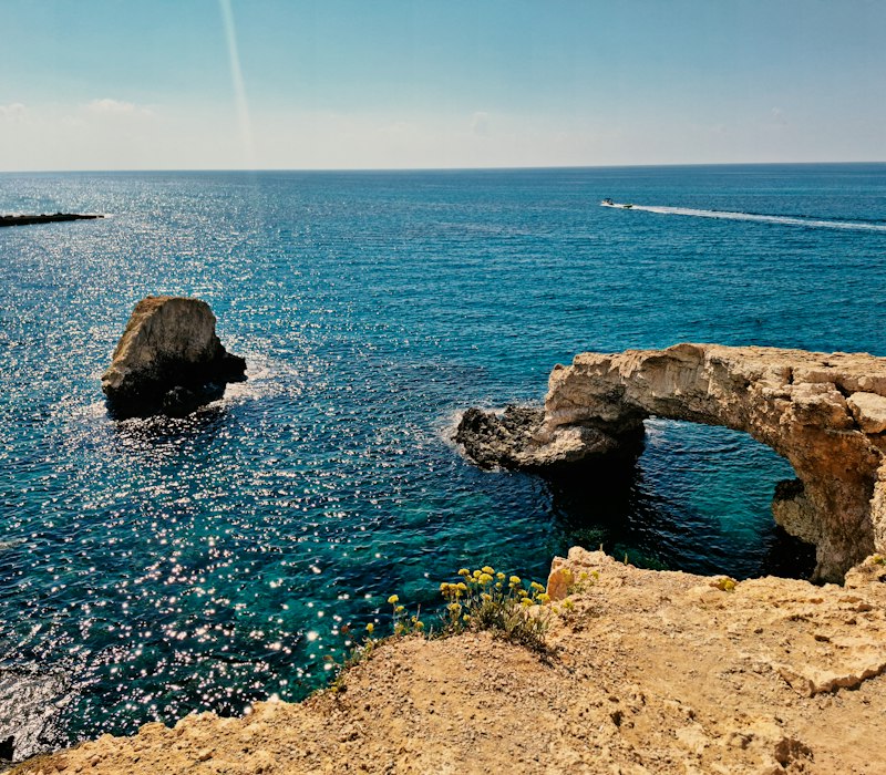 A natural rock arch in the sea at Cape Greco