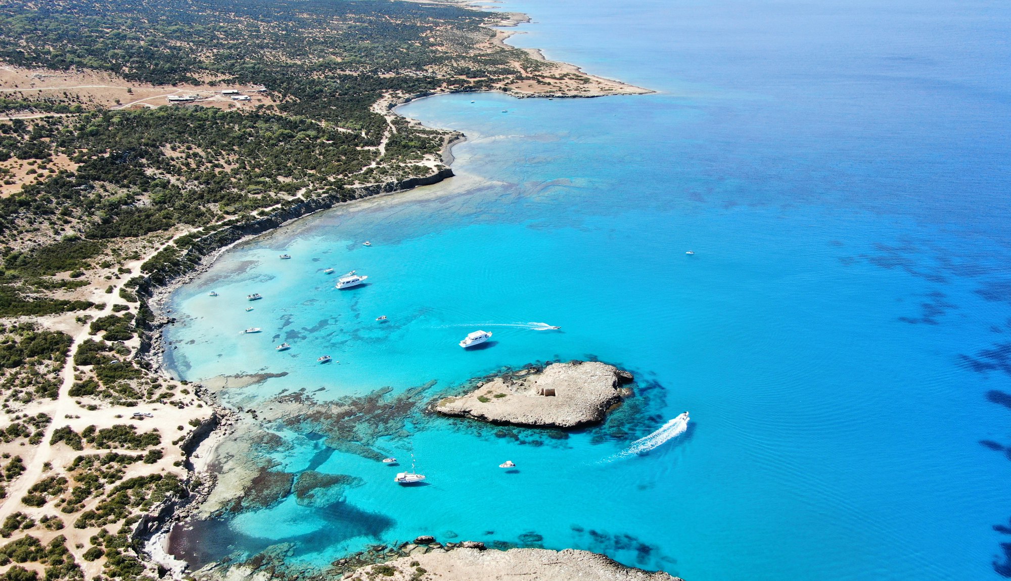 Turquoise water and a sandy bay on the coast near Paphos in Cyprus