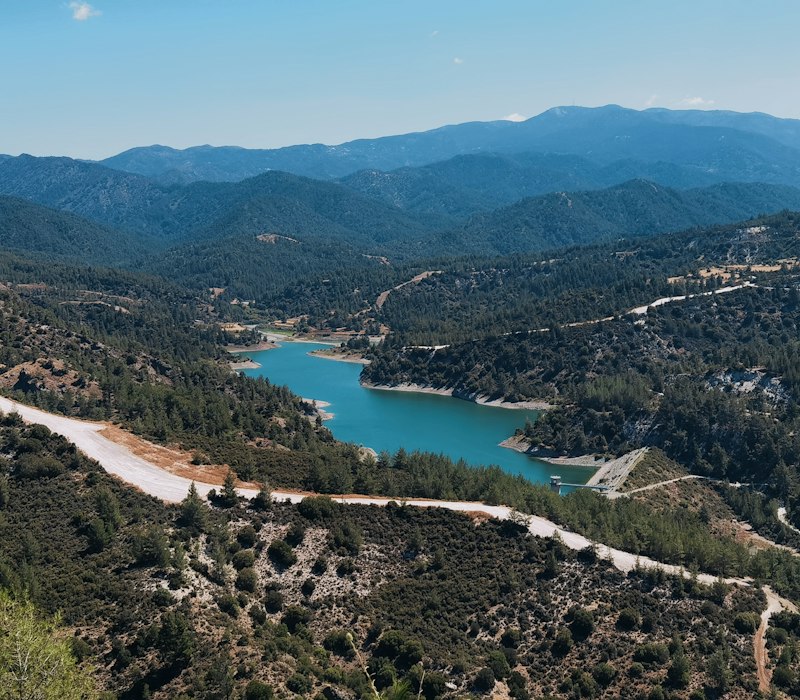 A lake among the green hills of the Troodos mountains