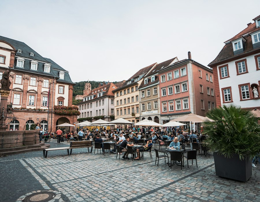 People in the old town square of Heidelberg in Germany