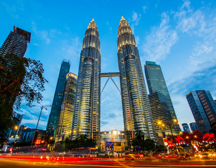 The Petronas Twin Towers against a blue sky in Kuala Lumpur