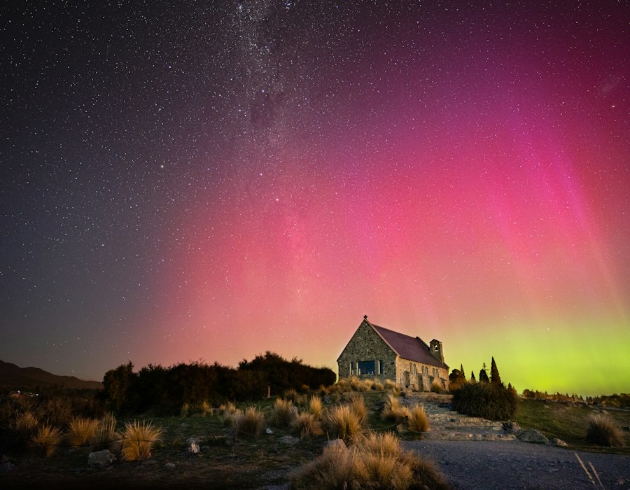The southern lights over a small church at Lake Tekapo