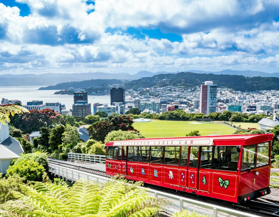 The red Wellington cable car above the city