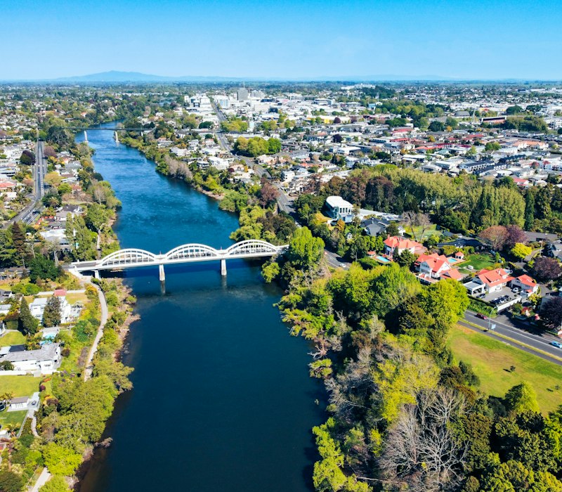 A river and bridge in a green New Zealand city