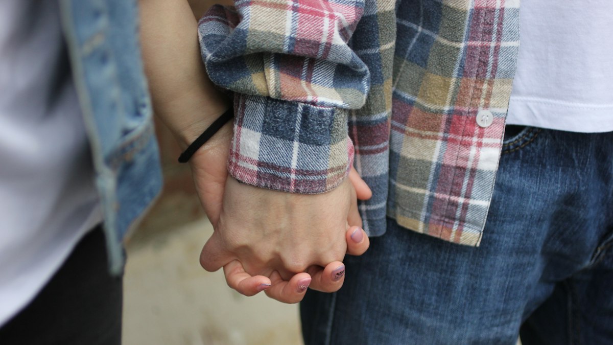 A couple holding hands