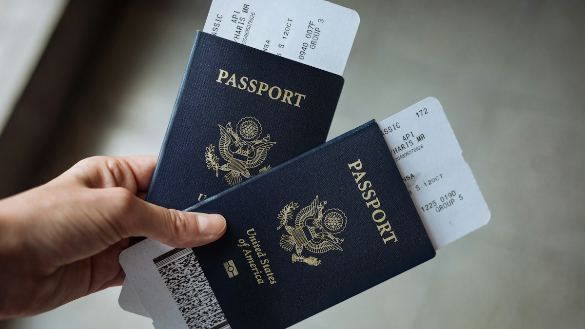 Passports held ready for travel