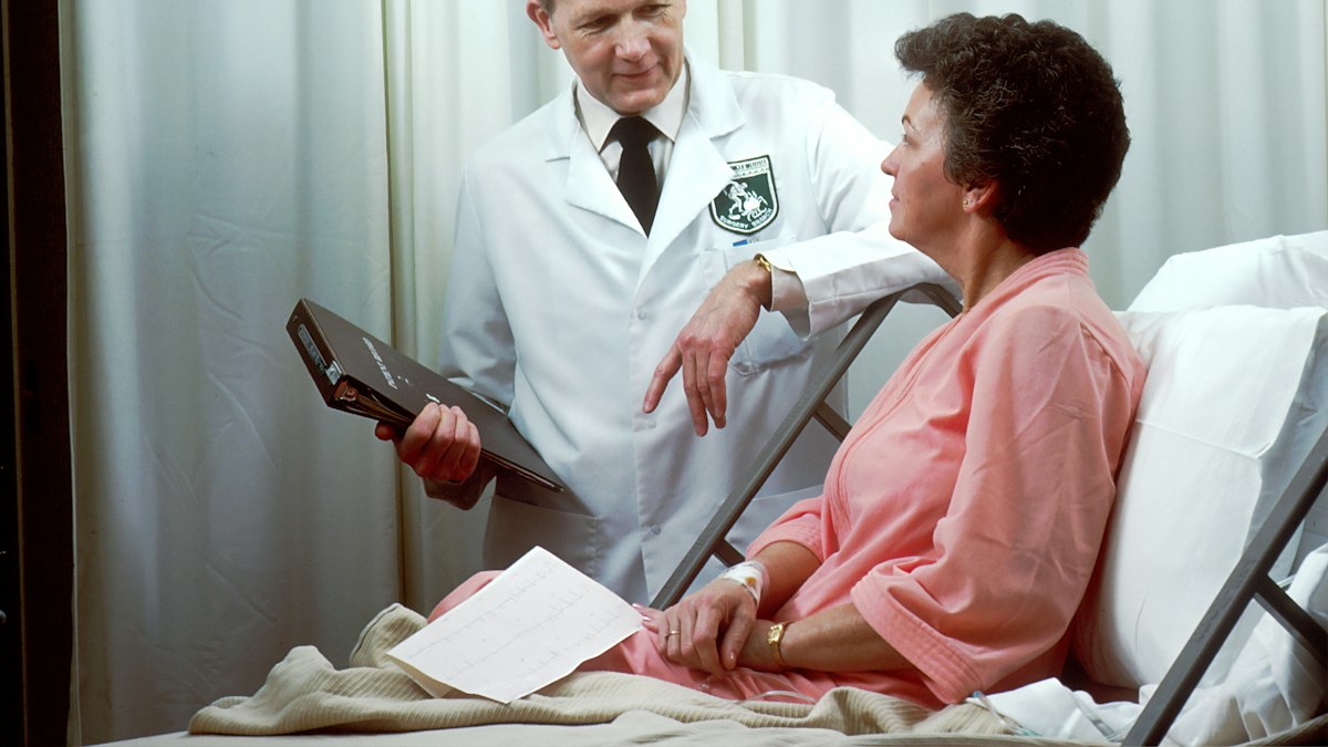 A doctor visiting a patient
