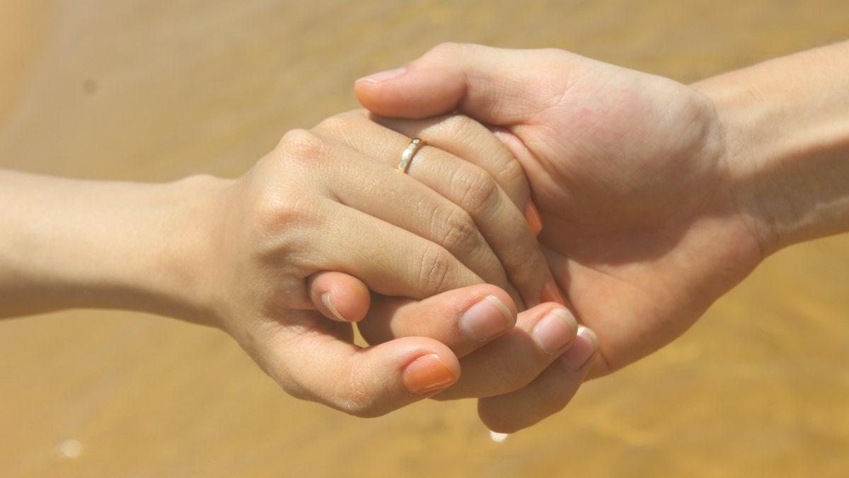 A couple holding hands