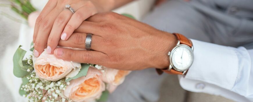 A couple's hands with wedding rings