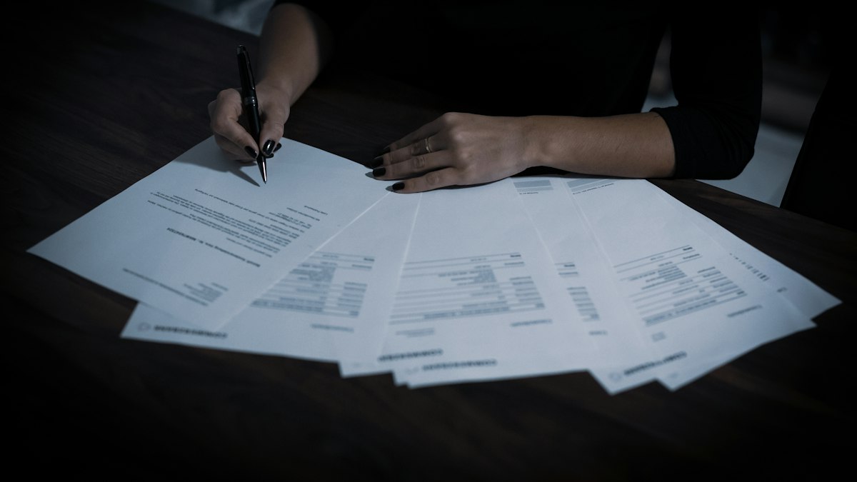 Papers spread across a desk for review