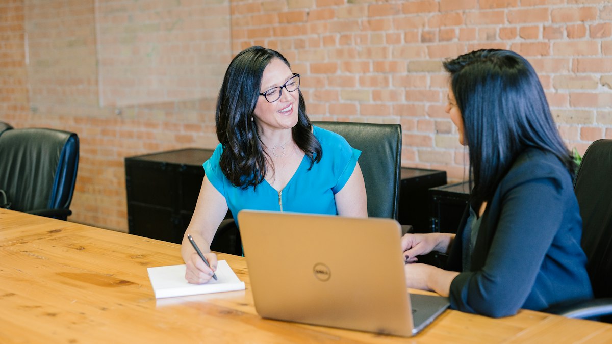 Two advisers discussing a case