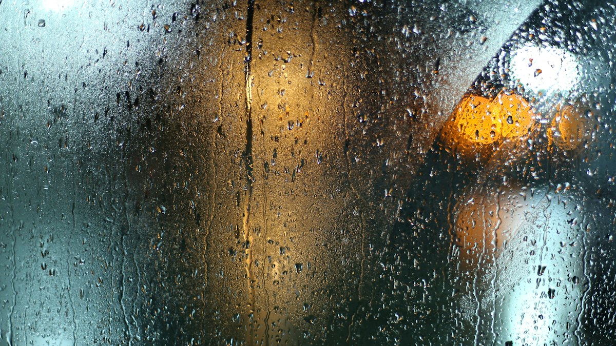 Rain on a window at night