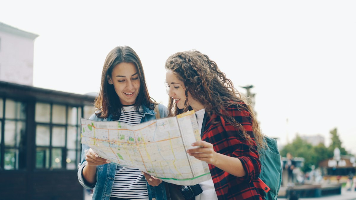 Two travellers reading a map together