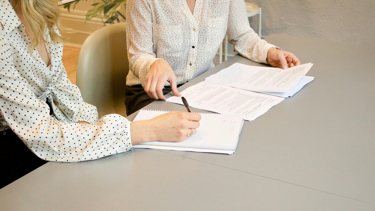 Documents being reviewed and signed