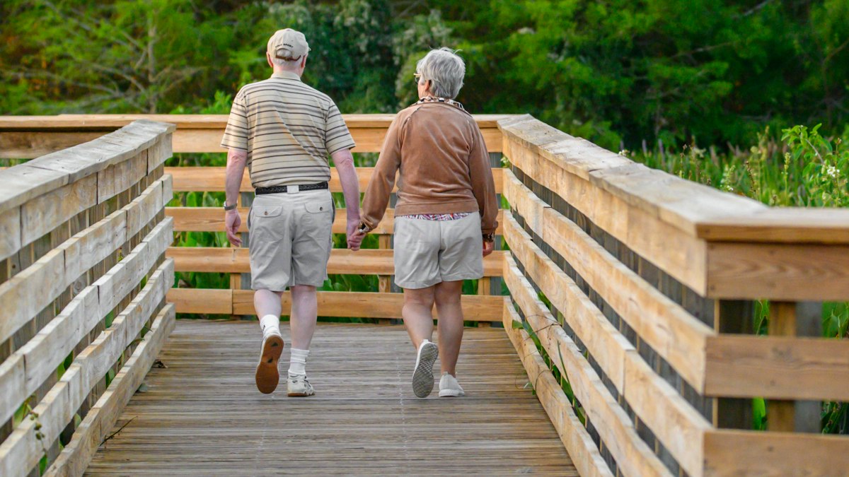 An older couple walking together