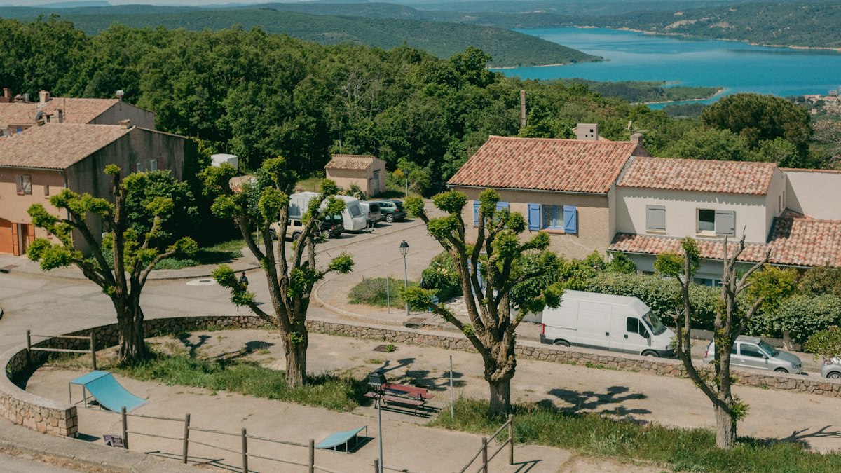 A French village between hills and a lake