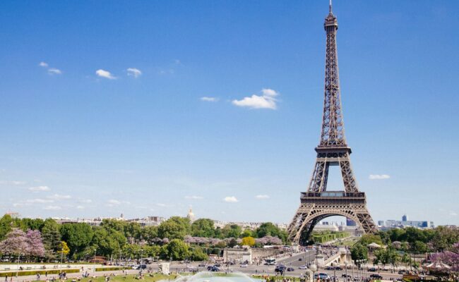 The Eiffel Tower under a blue sky
