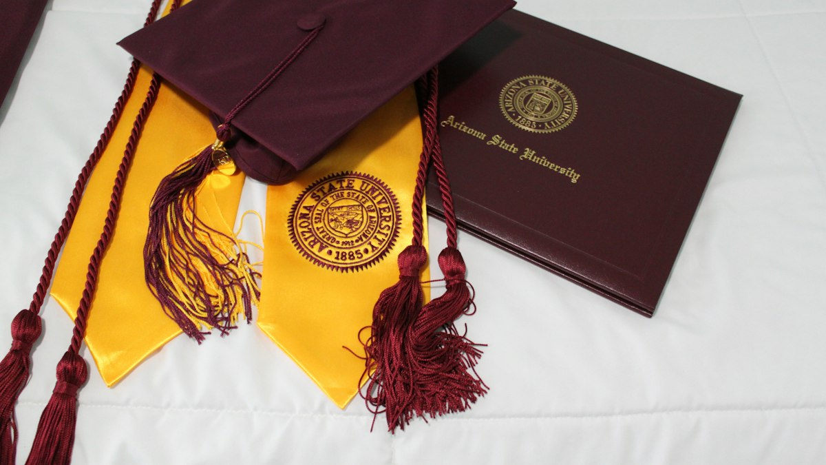 A diploma and graduation stole