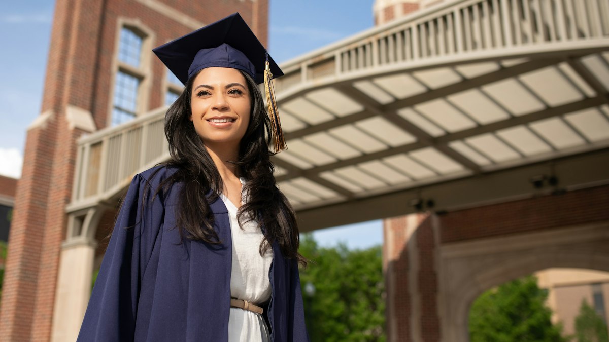 A proud graduate in cap and gown