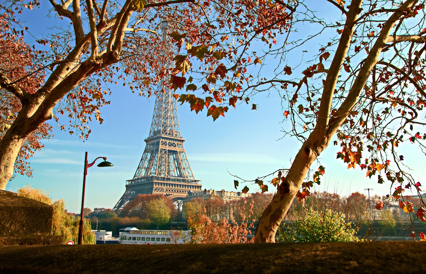 The Eiffel Tower in autumn with golden leaves