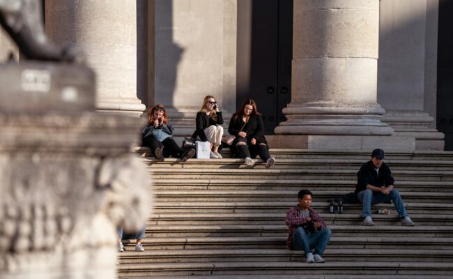 Students sitting on university steps