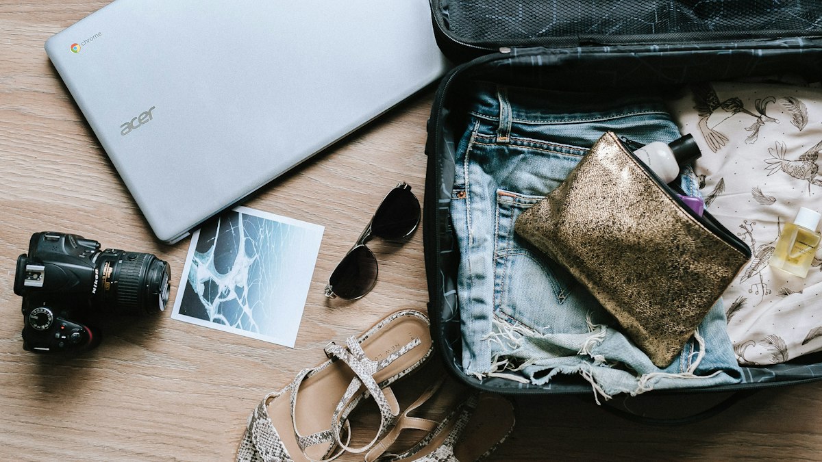 A suitcase being packed for travel