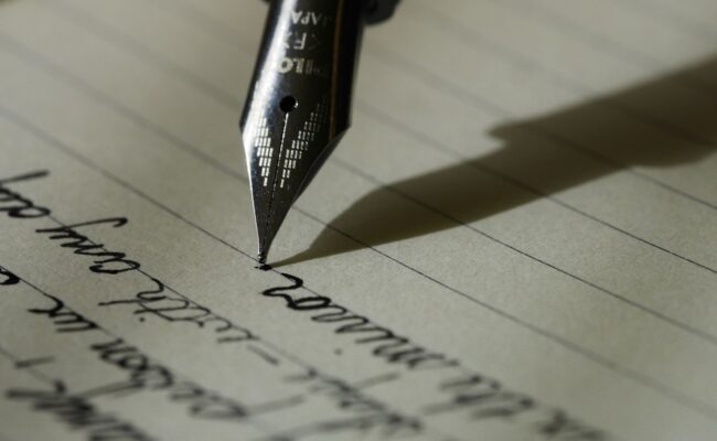 A fountain pen writing on paper