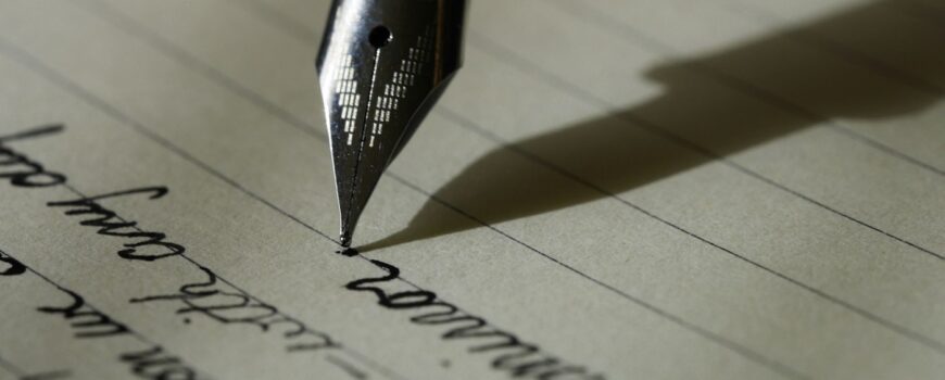A fountain pen writing on paper