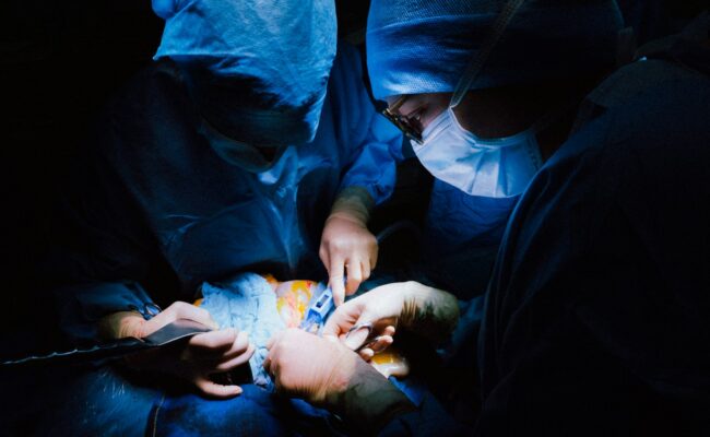 Surgeons working in an operating theatre