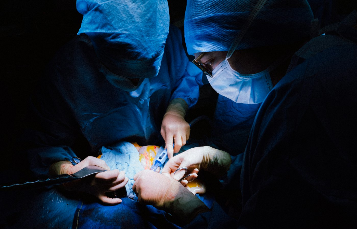 Surgeons working in an operating theatre