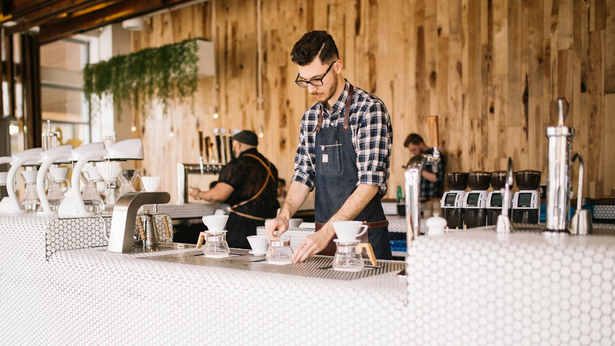 Staff working in a busy coffee shop