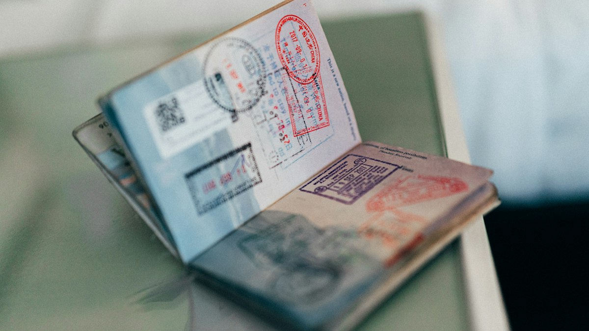 Passports and visa documents on a table