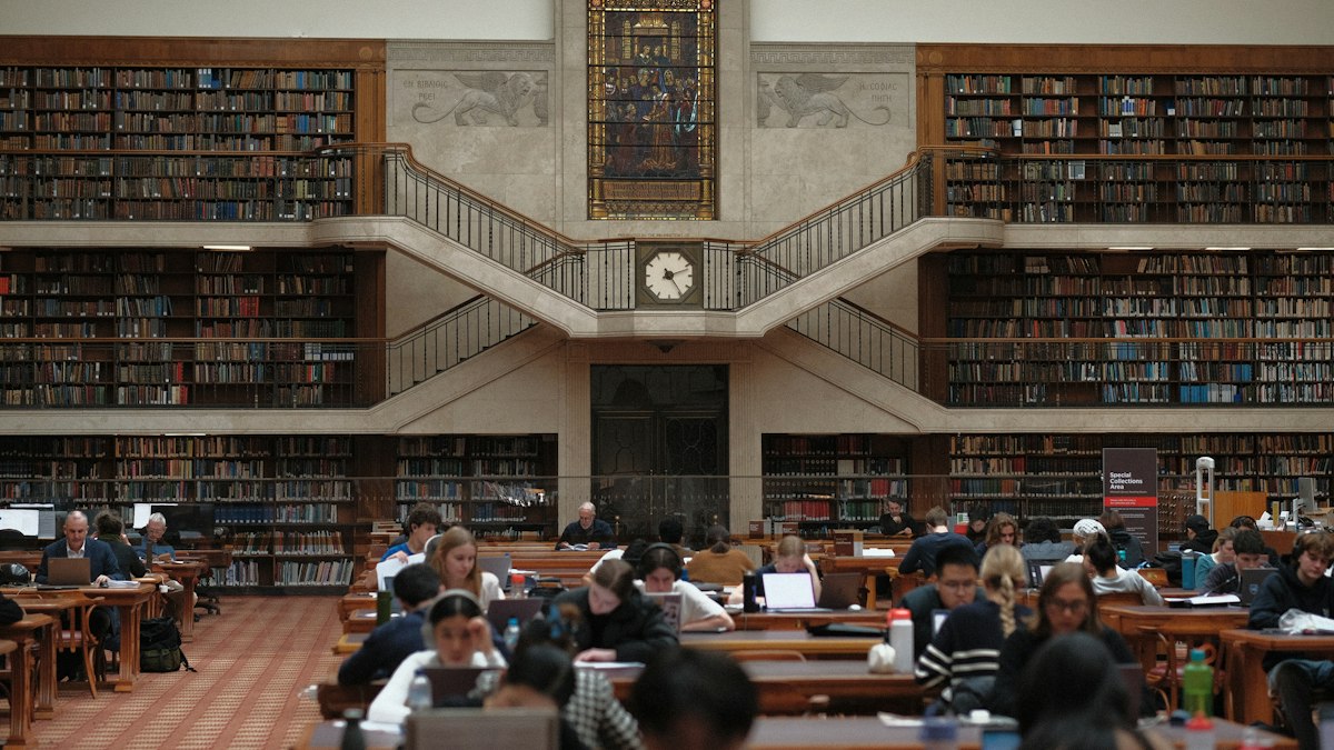 A large university library with reading tables