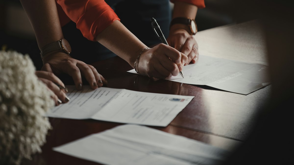 People reviewing paperwork together