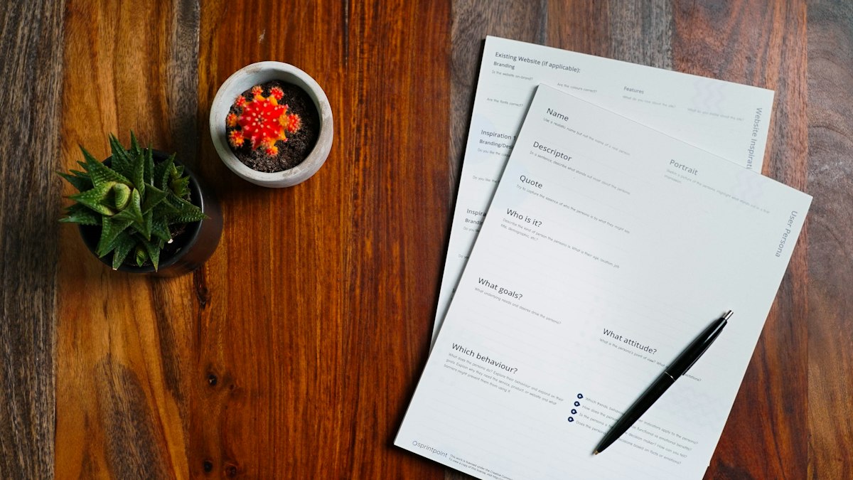 Documents and a laptop on a desk