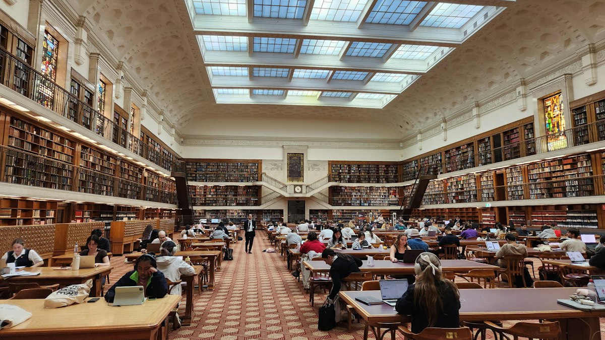 Students studying in a large university library